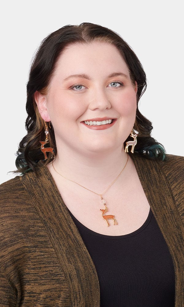 Model showing off a necklace made with resin
